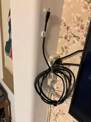 a cord hooked up to a computer monitor at &y Kitasenju in Tokyo