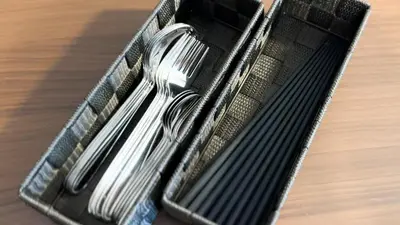 two silver utensils in a basket on a table at Goodsite In Oshiage in Tokyo