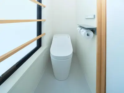 a bathroom with a toilet and a window at Sakura Cross Hotel Ueno Iriya Annex in Tokyo
