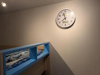 a clock on the wall of a room at Great location Only 1 minute to St G-18 Ginza Line in Tokyo