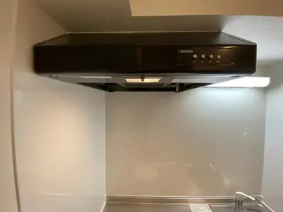 a stove top oven in a kitchen next to a wall at Great location Only 1 minute to St G-18 Ginza Line in Tokyo