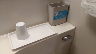 a toilet with a roll of toilet paper on top of it at Toyoko Inn Tokyo Nihombashi Ningyocho in Tokyo