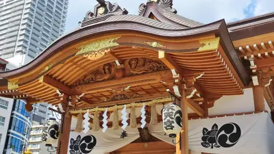 a wooden gazebo in a city with buildings at Toyoko Inn Tokyo Nihombashi Ningyocho in Tokyo
