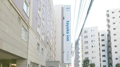 a building with a sign on the side of it at Toyoko Inn Tokyo Monzen-nakacho Eitaibashi in Tokyo