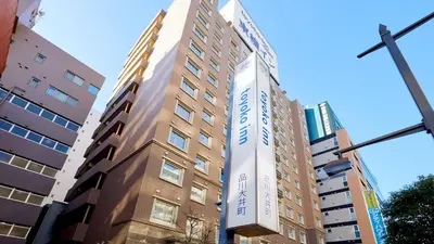 a tall building with a sign on the side of it at Toyoko Inn Tokyo Shinagawa Oimachi in Tokyo