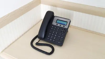 a black phone sitting on top of a box at Toyoko Inn Tokyo Nihombashi Hamacho Meijiza Mae in Tokyo