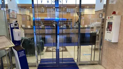 a glass door in a building with a library at Toyoko Inn Nihombashi Bakurocho in Tokyo