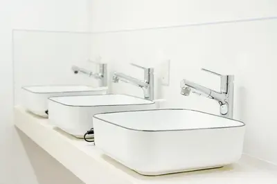two sinks on a shelf in a bathroom at Shinjuku ICE MOUNTAIN GUEST HOUSE in Tokyo