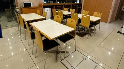 a group of tables and chairs in a classroom at Toyoko Inn Tokyo Yamanote sen Otsuka eki Kita guchi No 2 in Tokyo