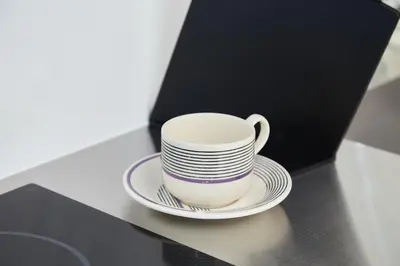 a coffee cup and a plate on a counter at Asakusa New City Hotel in Tokyo