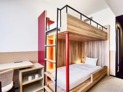 a bedroom with bunk beds in a hostel at LOISIR HOTEL SHINAGAWA SEASIDE in Tokyo