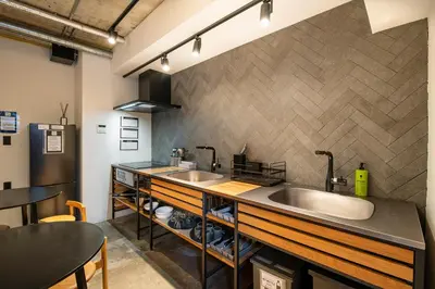 a kitchen with two sinks and a counter at Hotel Asakusa KANNONURA in Tokyo