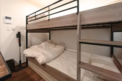 a couple of bunk beds in a room at Stylewood Nishi-Shinjuku by Tranova in Tokyo