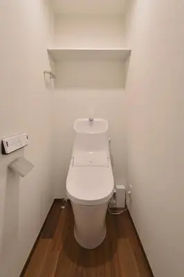 a bathroom with a white toilet in a room at Stylewood Nishi-Shinjuku by Tranova in Tokyo