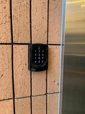 a remote control on the side of a brick wall at the Moto Hotel Asakusa in Tokyo