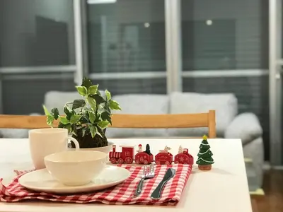 a table with a plate and a coffee cup and a christmas decoration at PRISM COURT \u7dbe\u702c in Tokyo