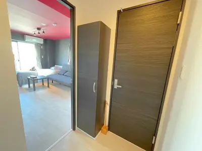 a sliding door in a room with a living room at Mr Kintaro Hotel Asakusa South in Tokyo