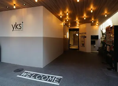 a lobby of a store with a sign on the floor at yksi SAUNA & STAY in Tokyo