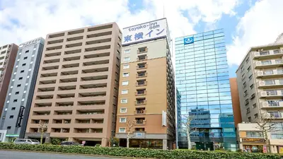 a building with a sign on top of it at Toyoko Inn Tokyo Ueno Tawaramachi eki in Tokyo