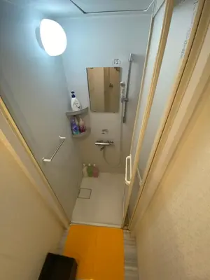a bathroom with a walk in shower and a sink at 54Journey \u6771\u4eac\u8d64\u5742\u30db\u30b9\u30c6\u30eb in Tokyo