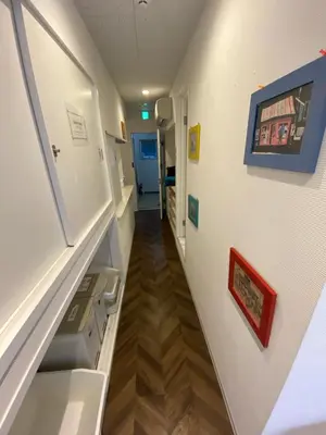 an empty hallway of a hospital room with a hallway at 54Journey \u6771\u4eac\u8d64\u5742\u30db\u30b9\u30c6\u30eb in Tokyo