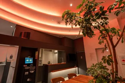 a dining room with a table and a tree at COB HOTEL Asakusa in Tokyo