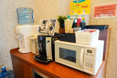 a counter with several microwaves and appliances on it at COB HOTEL Asakusa in Tokyo
