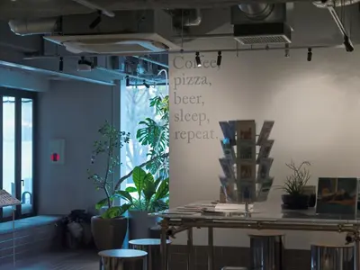 a room with a wall with plants on it at all day place shibuya in Tokyo