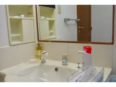 a bathroom with a sink and a mirror at NYOZE House - Vacation STAY 84305v in Tokyo