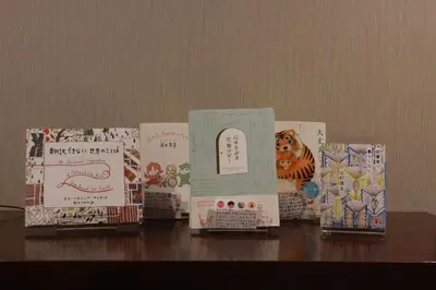 a group of boxes sitting on top of a table at BOOK HOTEL \u795e\u4fdd\u753a in Tokyo