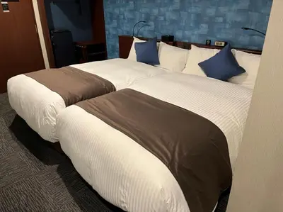 two beds in a hotel room with two at BOOK HOTEL \u795e\u4fdd\u753a in Tokyo