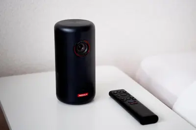 a remote control sitting on a table next to a camera at renovated in June 2025 apartment 3mins walk to station 1stop to Shinjuku 3stop to Shibuya in Tokyo