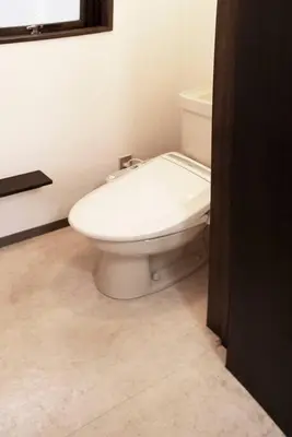 a bathroom with a white toilet in a room at ③2station to Shinjuku. 3 double beds. Specious 45㎡ in Tokyo