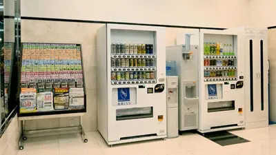 a row of refrigerators in a grocery store at Toyoko Inn Tokyo Otemachi in Tokyo