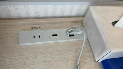an electronic device with a cord plugged into a box at Toyoko Inn Tokyo Keihin Tohoku sen Oji eki Kita guchi in Tokyo