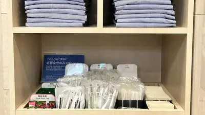 a shelf filled with plastic bags and other items at Toyoko Inn Omori in Tokyo