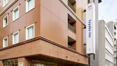 a building with a sign in front of it at Toyoko Inn Omori in Tokyo