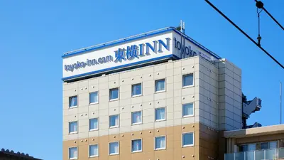 a building with a sign on top of it at Toyoko Inn Tokyo Shinagawa Hatanodai eki Minami guchi in Tokyo