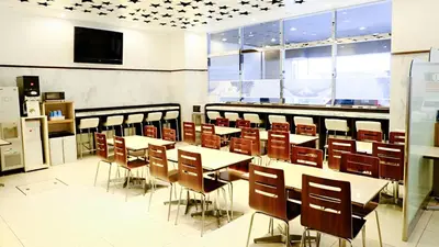 a classroom with tables and chairs and a tv at Toyoko Inn Tokyo Nihombashi Zeimusho Mae in Tokyo