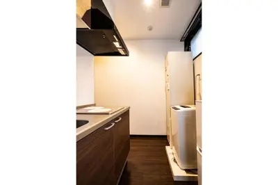 a small kitchen with a sink and a refrigerator at Apartment Sun Bright - Vacation STAY 89260v in Tokyo