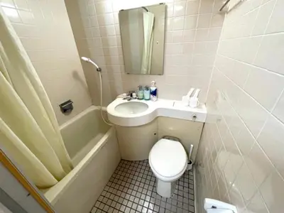 a bathroom with a sink and a toilet and a bath tub at Tokyo Stay Excel Shinjuku in Tokyo