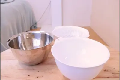 a bowl and a metal bowl on a wooden table at Tokyo Stay Excel Shinjuku in Tokyo