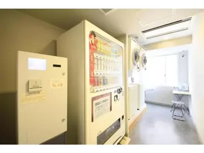 a room with a refrigerator in the corner of a room at R&B Hotel Tokyo Toyocho - Vacation STAY 40490v in Tokyo