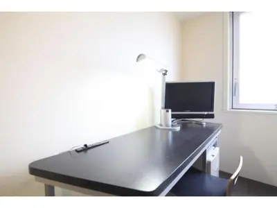a desk with a lamp and a computer on it at R&B Hotel Tokyo Toyocho - Vacation STAY 40490v in Tokyo