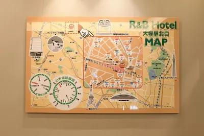 a map of paris on a wall at R&B Hotel Otsuka Eki Kitaguchi - Vacation STAY 40485v in Tokyo