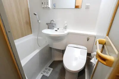 a small bathroom with a toilet and a sink at R&B Hotel Otsuka Eki Kitaguchi - Vacation STAY 40485v in Tokyo