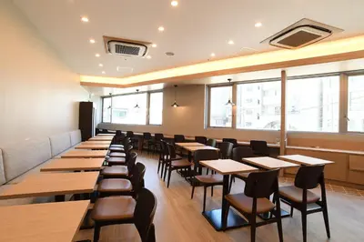 a row of tables and chairs in a restaurant at R&B Hotel Otsuka Eki Kitaguchi - Vacation STAY 40488v in Tokyo
