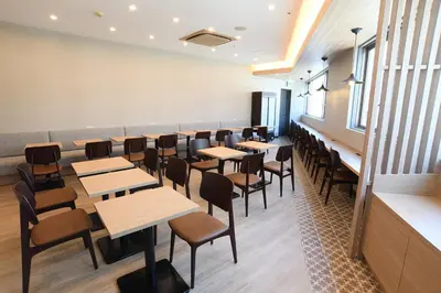 a row of tables and chairs in a restaurant at R&B Hotel Otsuka Eki Kitaguchi - Vacation STAY 40488v in Tokyo