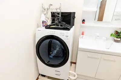a washing machine in a kitchen next to a counter at The Felice Uguisudani - Vacation STAY 96221 in Tokyo