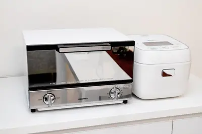 a toaster and a toaster oven sitting on a counter at The Felice Uguisudani - Vacation STAY 96221 in Tokyo